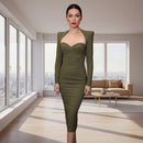 Person wearing a green dress in an indoor setting